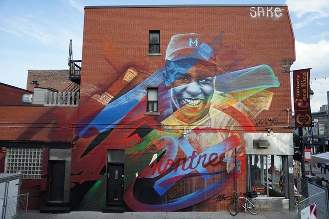 The Original Montreal Mural Arts Tour by Spade & Palacio - Stop 3: Saint-Laurent Boulevard, Where the City’s Story Shows Up on Walls